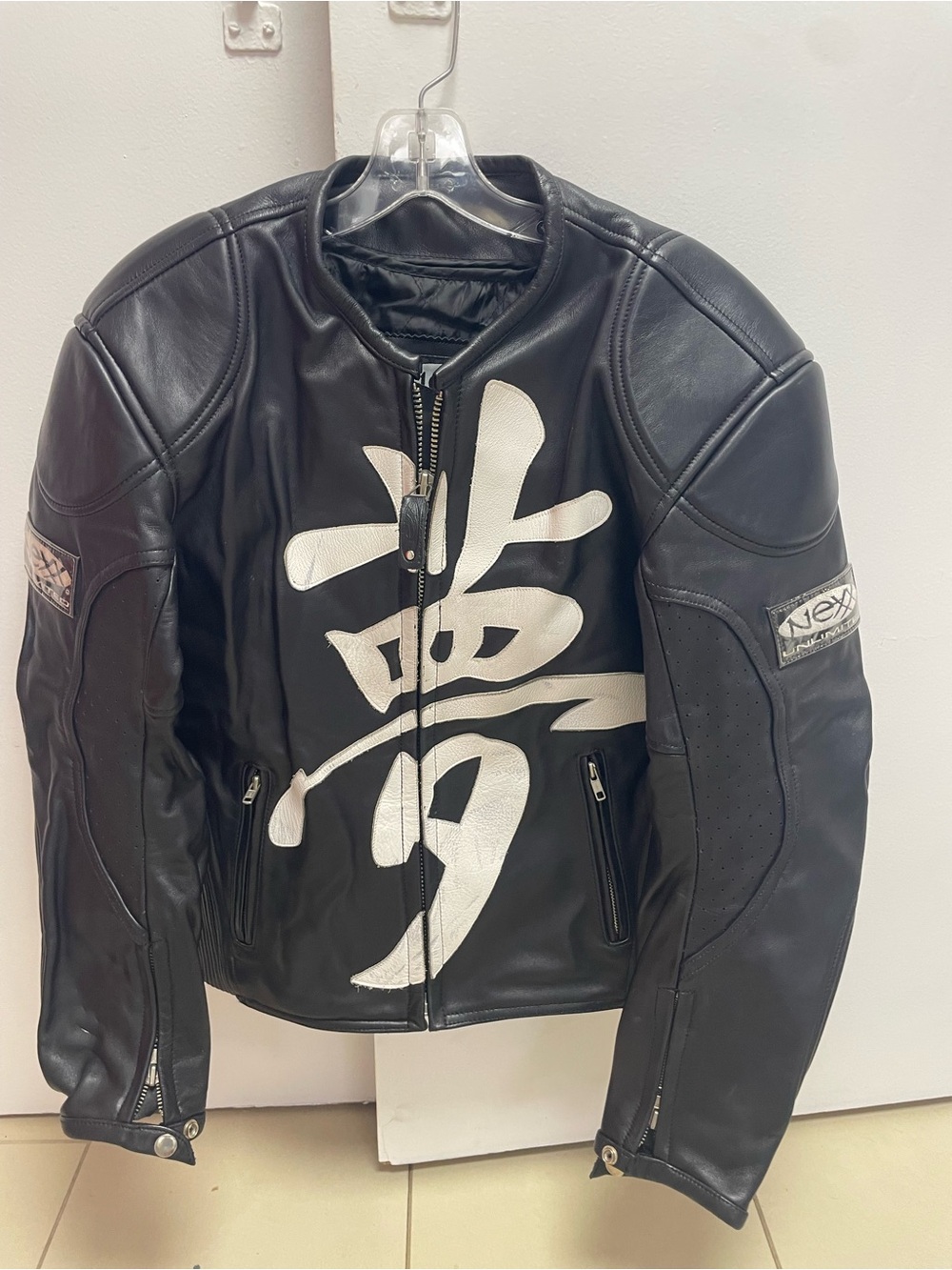 The Limited Black Leather Jacket with White Kanji Graphic
